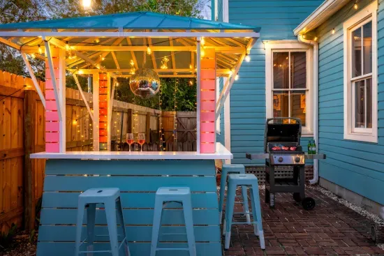 The vibrant outdoor bar is a party-ready centerpiece for your evenings. With its cheerful colors, a disco ball, and charming string lights, it’s ideal for mixing up your favorite cocktails or enjoying drinks with friends.