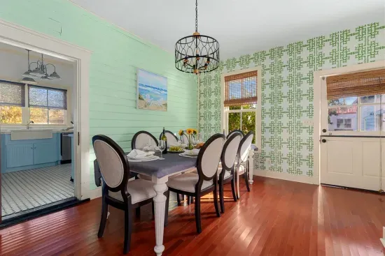 The dining area boasts a blend of vintage elegance and modern flair, with comfortable seating and beautiful details that set the stage for memorable meals.