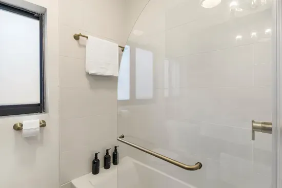 Bathroom with bathtub and shower