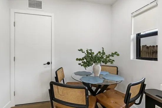Dining area in living room in adjacent unit