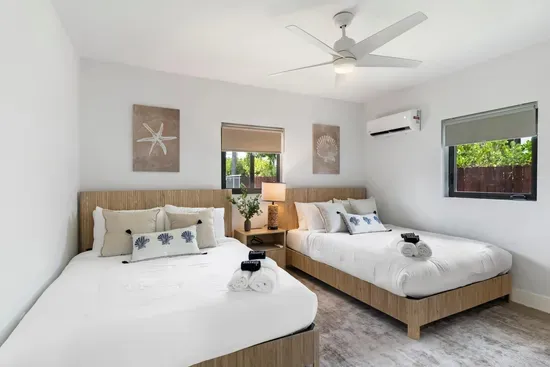 Bedroom 2 with 2 queen beds in adjacent unit