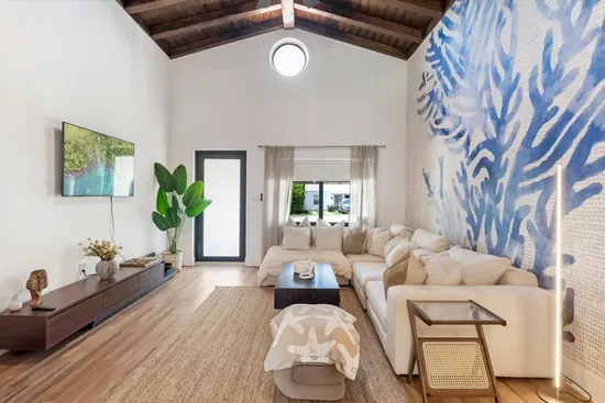 Liviing area with comfortable seating and TV