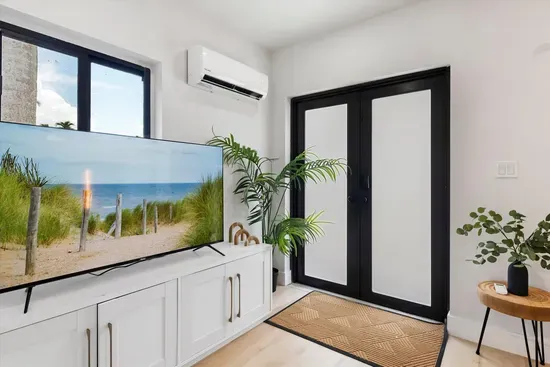Living area with TV in adjacent unit