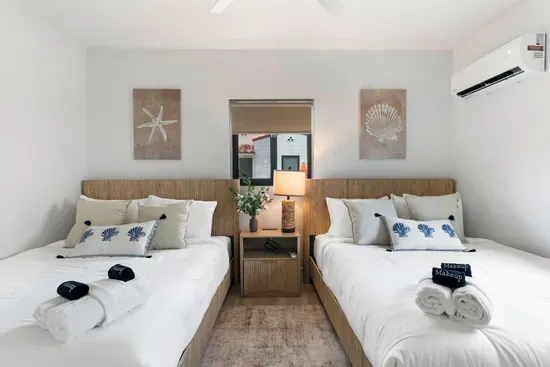 Bedroom 2 with 2 queen beds in adjacent unit