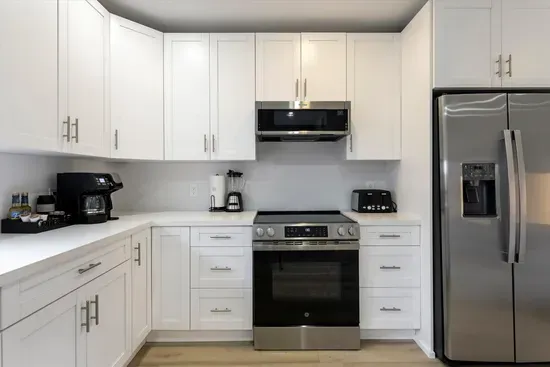 Well equipped kitchen in adjacent unit with oven, hob, dishwasher, microwave