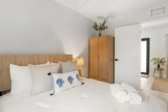 Master bedrooom with queen bed in adjacent unit