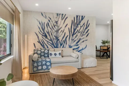 Living area with sofa bed in adjacent unit