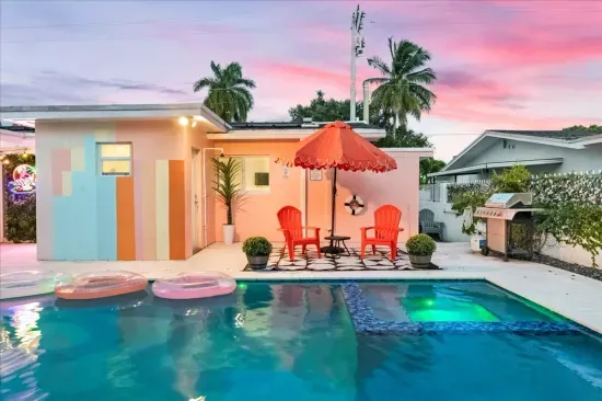 Outdoor Oasis: Kick back by the pool under vibrant hues and lounge in stylish sun chairs!
