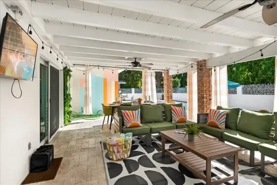 Outdoor Lounge: Vibrant patio with stylish seating, perfect for sunset hangouts and poolside fun!