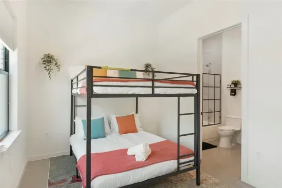 Bunk Room: Stylish bunk beds await, complemented by vibrant decor and an en-suite bath!