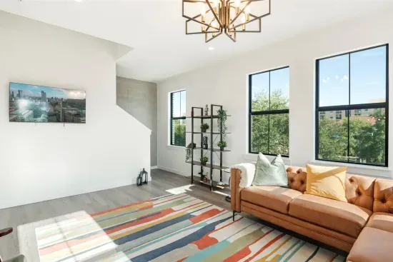 Living area with large comfortable sofa, TV, and amazing views
