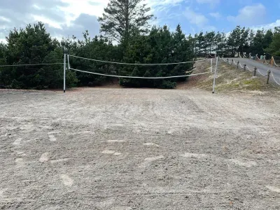 Full-size volleyball court on the  property