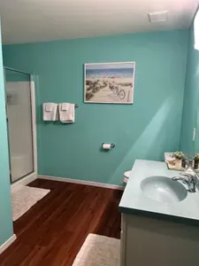 Walk-in shower next to the sauna room