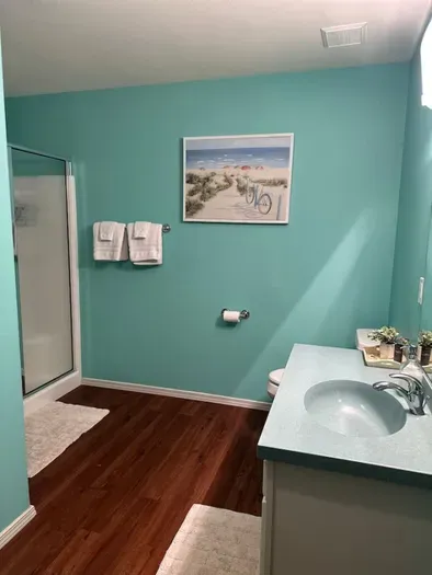 Walk-in shower next to the sauna room