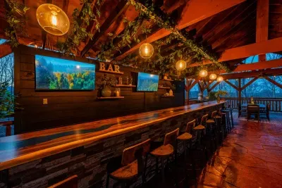 Custom bar with three wall mounted TV’s and bar seating for 12.