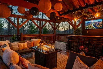 Custom outdoor bar with wall mounted TV’s and cozy seating area with fire table.