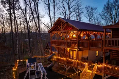 A heated indoor pool, hot tub, play ground, climbing walls, sports bar, oversized slide, and eating and lounging for 20…you and your guests will never want to leave the cabin!