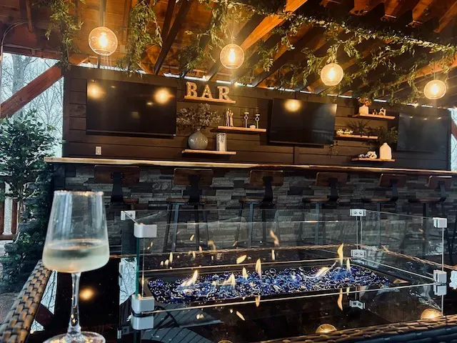 Custom Sports Bar with Seating for 12 and Cozy Fire Table/Seating Area