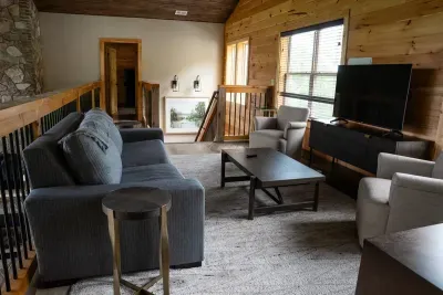 An upstairs Movie Viewing area with a pull out, pillow top Queen sleeper sofa