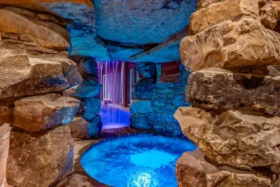 Relax in the whirlpool spa under the waterfall ...
