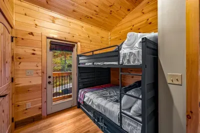 There are two upstairs Bunk Bedrooms, each with a Queen-on-Queen bunkbed, with a pull out twin underneath.