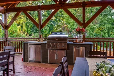Oversized Grill, Refrigerator, and Granite Countertops for Preparing and Serving Food