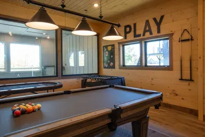 The game room overlooks the heated indoor pool.