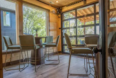 Cozy up in your personal coffee bar with stunning views and an open-air vibe from the garage door that opens onto the back deck. Sip your coffee or have a glass of wine at one of the high top tables and take in the mountain air.