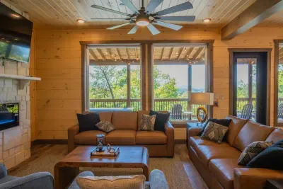 Gather, relax, and make memories! The inviting living room, complete with plush couches and a cozy indoor fireplace, is the perfect space for laughter, conversations, and unwinding after a day of adventures.