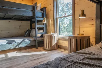 One of two bunk rooms with queen over queen bunk beds.