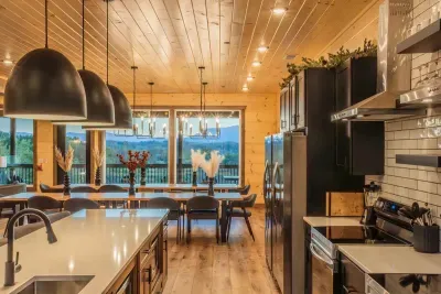 Dine in style with a view. Two full sized refrigerators, three dishwashers and two stovetops/ovens make feeding large groups a breeze.