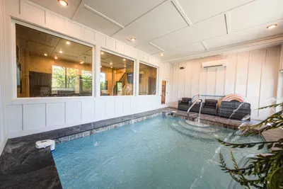 Let the kids splash in the indoor pool and dive under the waterfall while the deck jets arc water over them.