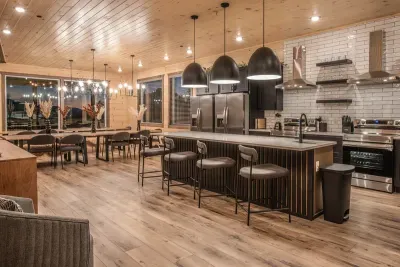 Enjoy a massive chef's kitchen flowing into the dining area with seating for 25 and views of the mountain ranges of the Smokies off the back deck.