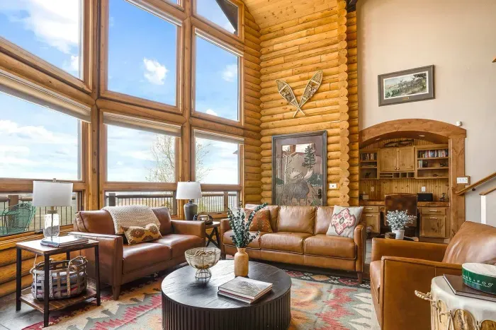 Main floor living room with a pullout queen size bed.