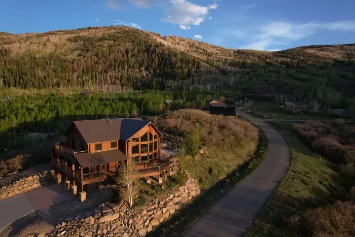Aerial view of Ski and Ride Mountain Haus property and stunning views of Powderhorn ski resort, the Grand Mesa, and the Bookcliffs.