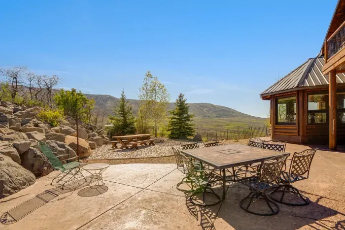 Year round outdoor seating, fire pit, and grilling area for comfortable family and friend gatherings to eat, play games, relax, and enjoy the stunning views of Powderhorn ski resort, the Grand Mesa, and the Bookcliffs.