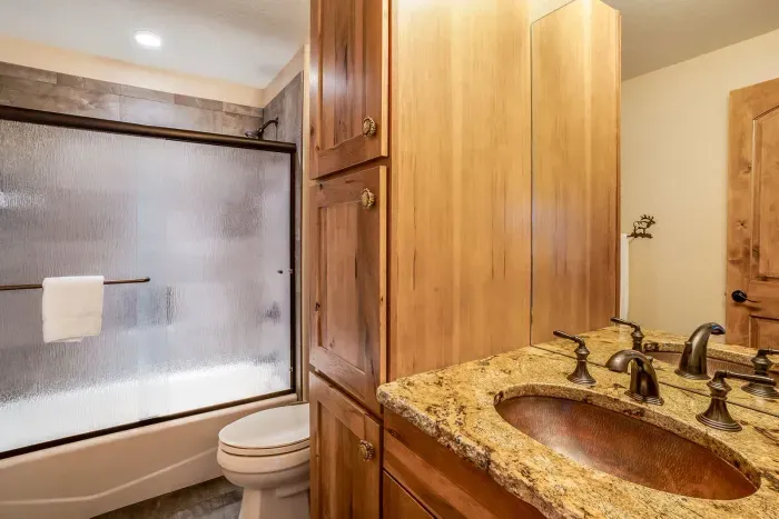 Second floor spacious bathroom with tub and shower.
