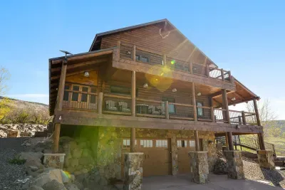 The garage has an unloading and storage area for your skis, bikes, and other outdoor toys. Then take the wide, easy steps into the cabin main floor. You can also drive up the side gravel driveway for easy unloading to the kitchen and back patio.