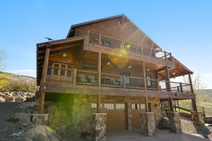 The garage has an unloading and storage area for your skis, bikes, and other outdoor toys. Then take the wide, easy steps into the cabin main floor. You can also drive up the side gravel driveway for easy unloading to the kitchen and back patio.