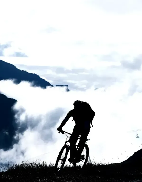 Mountain biking above clouds