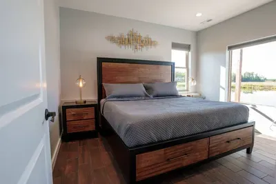 Enjoy views of Sunset Lake from this King bedroom.