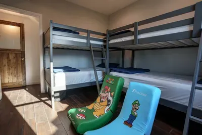 Perfect for kids, this bedroom features 2 bunk bed sets, sleeping 4.  These premium bunks have upgraded weight limits and can easily handle adults.