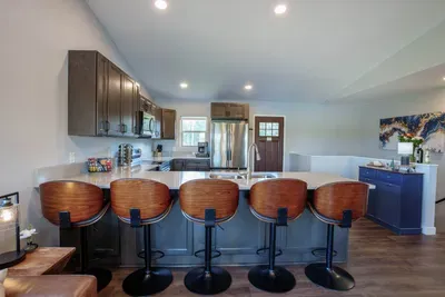 There is plenty of space for everyone at our expansive eat-in kitchen.  The kitchen is well-equipped with all the essentials from spices to pots and pans.
