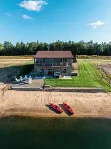Located directly on Sunset Lake, you'll have your own secluded private beach with 2 kayaks and a floating lily pad for the kids!