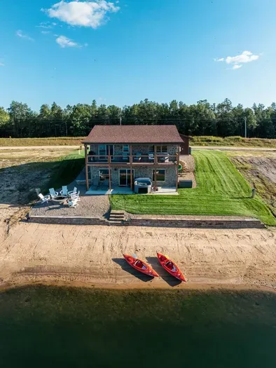 Located directly on Sunset Lake, you'll have your own secluded private beach with 2 kayaks and a floating lily pad for the kids!