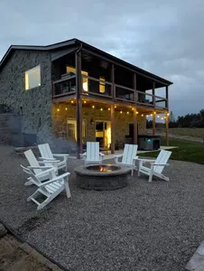 Enjoy the backyard equipped with a fire pit, hot tub, and covered deck!