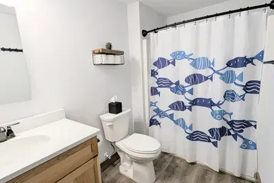 This full bathroom has a bathtub for your convenience. (DOWNSTAIRS)