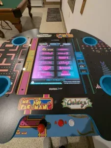 Enjoy some friendly competition on this classic arcade pub table!