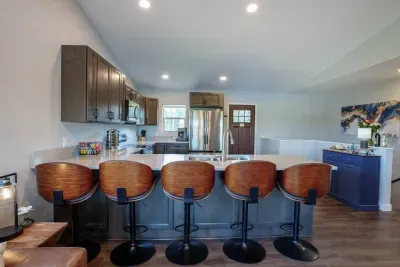 There is plenty of space for everyone at our expansive eat-in kitchen.  The kitchen is well-equipped with all the essentials from spices to pots and pans.