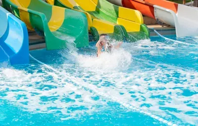 girl-rides-with-a-water-slide-in-the-water-park-2026-01-11-08-52-13-utc